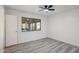 Bedroom featuring wood-look flooring, natural light, and a view of the covered patio at 2004 W Kristal Way, Phoenix, AZ 85027