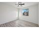 Bedroom showcasing a ceiling fan and new flooring, filled with natural light at 2004 W Kristal Way, Phoenix, AZ 85027