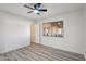 Bedroom featuring wood-look flooring, natural light, and a view of the covered patio at 2004 W Kristal Way, Phoenix, AZ 85027