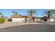 Charming single-story home with desert landscaping, mature palm trees, and a two-car garage in a desirable location at 2004 W Kristal Way, Phoenix, AZ 85027