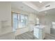 Modern kitchen with white cabinets, stainless steel appliances, a skylight, and an adjacent dining area at 2004 W Kristal Way, Phoenix, AZ 85027