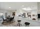Stylish kitchen with white cabinets, marble countertops, stainless steel appliances, and an adjacent dining area at 2004 W Kristal Way, Phoenix, AZ 85027