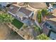 Aerial view of home's backyard features lush lawn, desert landscaping, and covered patio at 2004 W Kristal Way, Phoenix, AZ 85027
