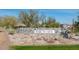 Stunning Victory community entrance with stone sign and lush desert landscaping at 20584 W Hillcrest Blvd, Buckeye, AZ 85396