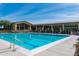 Spacious community pool with multiple lanes, seating, and views of the clubhouse at 20584 W Hillcrest Blvd, Buckeye, AZ 85396
