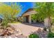 Spacious backyard featuring patio, desert landscaping, and tranquil outdoor setting at 20584 W Hillcrest Blvd, Buckeye, AZ 85396