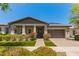 Charming single-story home with manicured lawn, desert landscape, and covered porch at 20584 W Hillcrest Blvd, Buckeye, AZ 85396