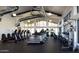State-of-the-art gym with treadmills, weights, and panoramic windows at 20584 W Hillcrest Blvd, Buckeye, AZ 85396