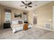 Comfortable main bedroom featuring a ceiling fan, neutral decor and attached ensuite bath with walk-in shower at 20584 W Hillcrest Blvd, Buckeye, AZ 85396