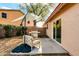 Backyard patio area with grill, shade umbrella, and comfortable seating space at 21640 N 48Th St, Phoenix, AZ 85054