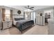This bedroom features a ceiling fan, wood floors, with an en-suite closet at 21640 N 48Th St, Phoenix, AZ 85054
