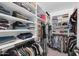 Walk-in closet with built-in shelving and hanging storage at 21640 N 48Th St, Phoenix, AZ 85054