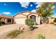Charming single-story home with a two car garage, desert landscaping and blue skies at 21640 N 48Th St, Phoenix, AZ 85054