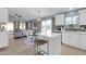 Open concept kitchen and living area with stainless steel appliances and light hardwood floors at 21640 N 48Th St, Phoenix, AZ 85054