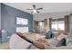 Well-lit living room featuring a comfortable sectional sofa, light hardwood floors, and sliding glass doors at 21640 N 48Th St, Phoenix, AZ 85054