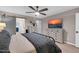 Bedroom with a decorative bed, dressers and sliding door access to the main bathroom at 21640 N 48Th St, Phoenix, AZ 85054