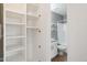 Bathroom with shower-tub combo, tiled floors, and white shelving at 2201 N Comanche Dr # 1080, Chandler, AZ 85224