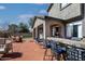 Outdoor space with covered seating area, lush green lawn, and a built-in bar, creating a perfect entertaining space at 2423 W Bramble Berry Ln, Phoenix, AZ 85085