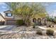 Charming two-story home with a well-manicured xeriscaped front yard and an arched entryway, plus desert landscaping at 2423 W Bramble Berry Ln, Phoenix, AZ 85085
