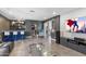 Open living space with a bar, entertainment center, and modern decor at 2423 W Bramble Berry Ln, Phoenix, AZ 85085