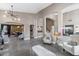 Open-concept living room with high ceilings, modern lighting, and elegant seating arrangements at 2423 W Bramble Berry Ln, Phoenix, AZ 85085