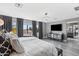 This main bedroom has a large bed, sleek gray walls, and modern decor, creating a restful retreat with a view at 2423 W Bramble Berry Ln, Phoenix, AZ 85085