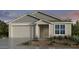 Charming single-story home with a two-car garage and inviting front entrance at 25132 N 171St Ln, Surprise, AZ 85387