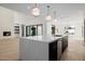 View of the kitchen island, fireplace, and sliding glass doors at 2636 N Fiesta St, Scottsdale, AZ 85257