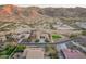 Aerial view of the home's exterior elevation showing the neighborhood and mountain views at 3211 E Ian Dr, Phoenix, AZ 85042