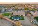 An aerial perspective showcasing a serene backyard pool and meticulously landscaped grounds at 3211 E Ian Dr, Phoenix, AZ 85042