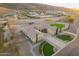 Expansive property featuring lush landscaping, a circular driveway, and beautiful mountain views at 3211 E Ian Dr, Phoenix, AZ 85042