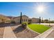 This property features a lush backyard area with desert landscaping and privacy at 3211 E Ian Dr, Phoenix, AZ 85042
