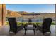 Backyard patio view featuring outdoor furniture, a pool, and a mountain view in the background at 3211 E Ian Dr, Phoenix, AZ 85042
