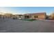 Expansive backyard featuring a pool with water features, a shaded patio, and desert landscaping at 3211 E Ian Dr, Phoenix, AZ 85042