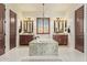 Beautiful bathroom with a soaking tub, chandelier, granite counters and double sink vanities at 3211 E Ian Dr, Phoenix, AZ 85042