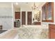 Beautiful bathroom with a soaking tub, chandelier, granite counters and double sink vanities at 3211 E Ian Dr, Phoenix, AZ 85042