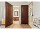 Entryway view of a bathroom with marble floors, vanity, and decorative fixtures at 3211 E Ian Dr, Phoenix, AZ 85042