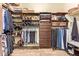Walk-in closet with custom shelving and organization, providing ample storage space at 3211 E Ian Dr, Phoenix, AZ 85042