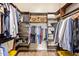 Walk-in closet with custom shelving and organization, providing ample storage space at 3211 E Ian Dr, Phoenix, AZ 85042