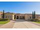 Beautiful home featuring desert landscaping, stone accents, and a large driveway at 3211 E Ian Dr, Phoenix, AZ 85042