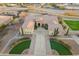 Beautiful front exterior featuring stone accents, mature landscaping, and a spacious driveway at 3211 E Ian Dr, Phoenix, AZ 85042
