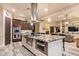 Gourmet kitchen featuring a large island, modern appliances, and abundant cabinet space for storage at 3211 E Ian Dr, Phoenix, AZ 85042
