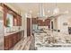 Bright kitchen has stainless appliances, custom cabinets, a large island with granite counters at 3211 E Ian Dr, Phoenix, AZ 85042