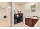 Modern laundry room with side-by-side appliances, granite counters, and ample storage at 3211 E Ian Dr, Phoenix, AZ 85042