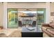 Inviting living room with seamless indoor-outdoor flow to a refreshing pool and mountain views at 3211 E Ian Dr, Phoenix, AZ 85042