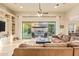 Open-concept living room with custom built-ins, backyard access, and a seamless flow to the outdoor living space at 3211 E Ian Dr, Phoenix, AZ 85042