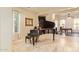 Elegant piano room showcases natural light and views into dining and living areas at 3211 E Ian Dr, Phoenix, AZ 85042