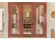 A beautiful wine cellar features custom wooden racks, ready to store your wine collection in style at 3211 E Ian Dr, Phoenix, AZ 85042
