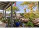 Backyard retreat boasting a covered patio, hot tub, pond, fire pit, mature trees, and a zen-like ambiance at 3302 W Tonto Ln, Phoenix, AZ 85027