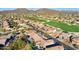 Aerial view of houses in a desert community with mountains in the background at 3517 N Paseo Del Sol --, Mesa, AZ 85207